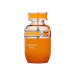 Flakon perfum Tropical Kiss French Avenue 80ml na tle tropikalnych owoców i kwiatów